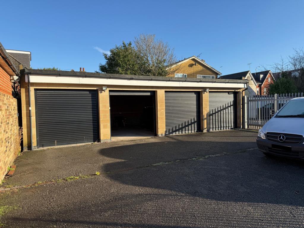 Lot: 78 - GARAGES AND FORECOURT WITH POTENTIAL - Garages with one shutter open